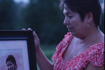 Laurie Odjick contemplates a photo of her daughter, Maisy